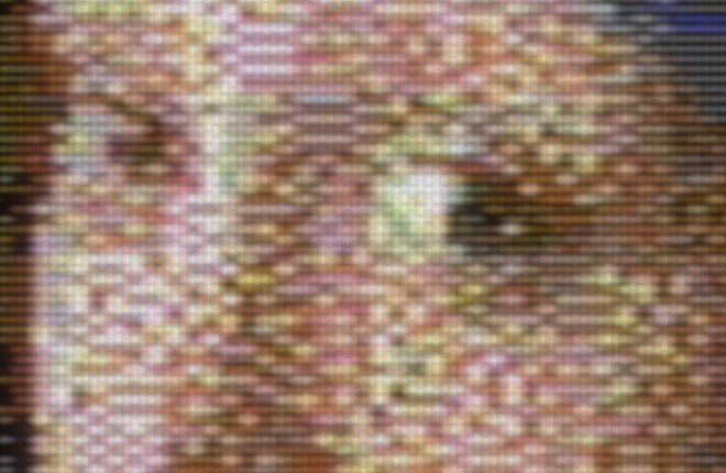 A close-up of the CRT view: the scan lines, the beam and the slot mask over the picture